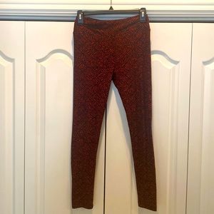 Like new.  Lularoe black and red leggings.  One size (fits 2-10)